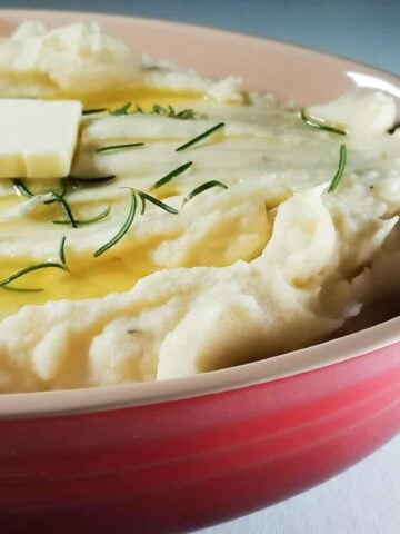 A casserole dish filled with Instant Pot Mashed Potatoes