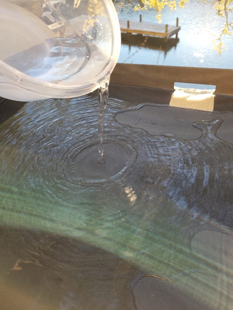Rinsing a Blackstone griddle with water