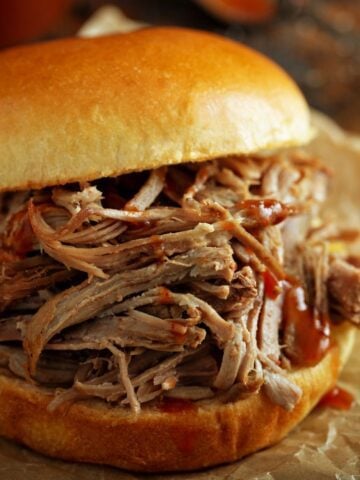 A large pulled pork sandwich on a bun